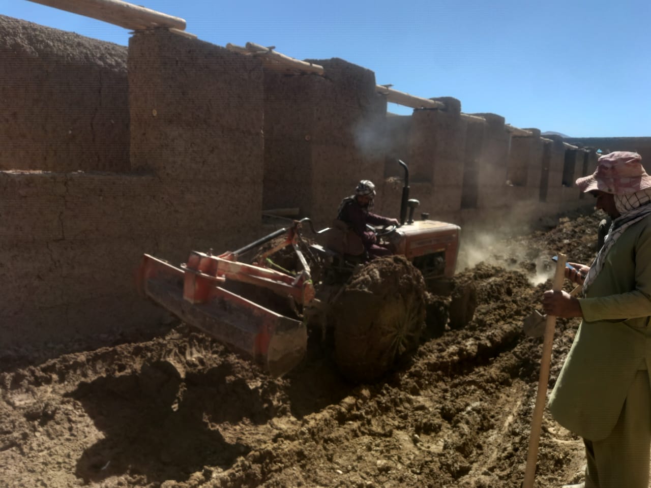 Tractor digging the boundary wall foundation trench at Captain Taj Mohammad Khan Lycee
