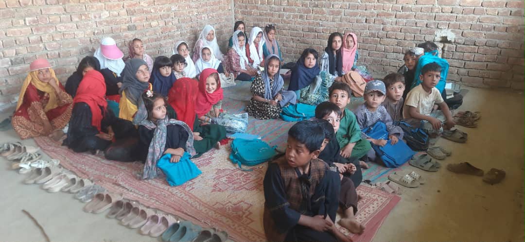 Students sitting on floor mats for class at Shikh Abad Girls School