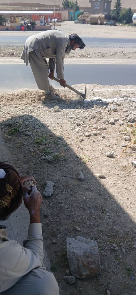 Workers digging the boundary wall foundation trench at Zarni Lycee