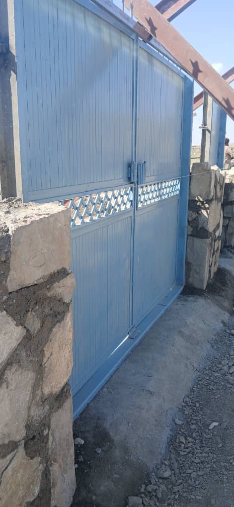 Completed blue security gate at Zarni Lycee